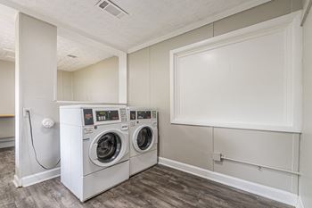 Laundry center with a folding tables at Pinewood Townhomes in Tucker, GA 30084